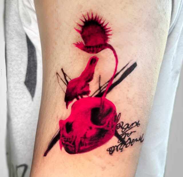 Radiant Figure — tattoo in crimson and black